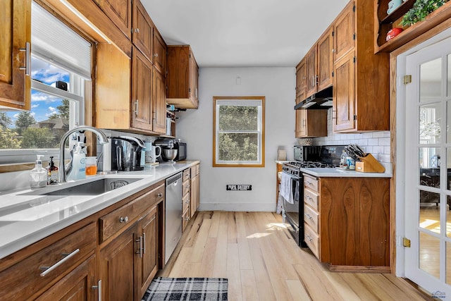 1016 W Blvd, Rapid City, SD 57701 - kitchen featuring light countertops, dishwasher, and black gas range
