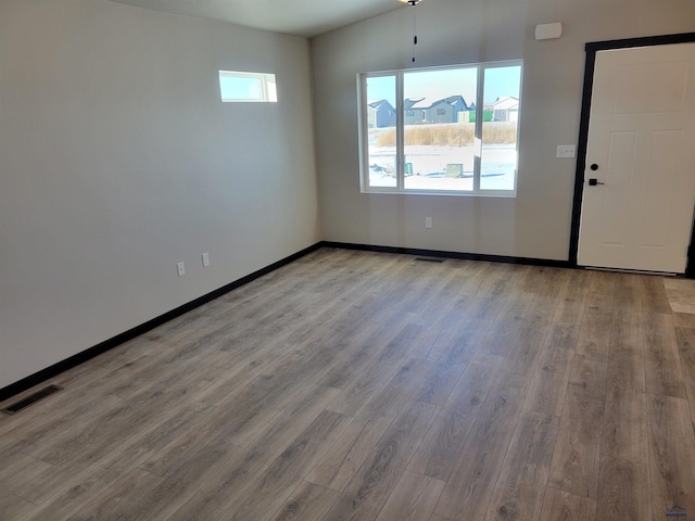 1154 Cobalt Dr, Rapid City, SD 57701 - empty room featuring wood finished floors and baseboards