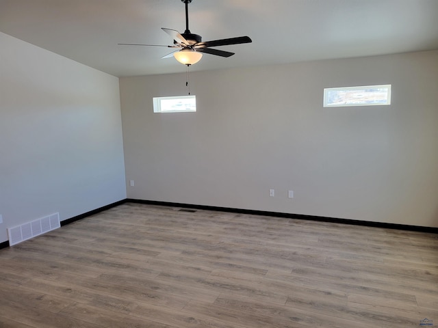 1154 Cobalt Dr, Rapid City, SD 57701 - spare room featuring ceiling fan, wood finished floors, and baseboards