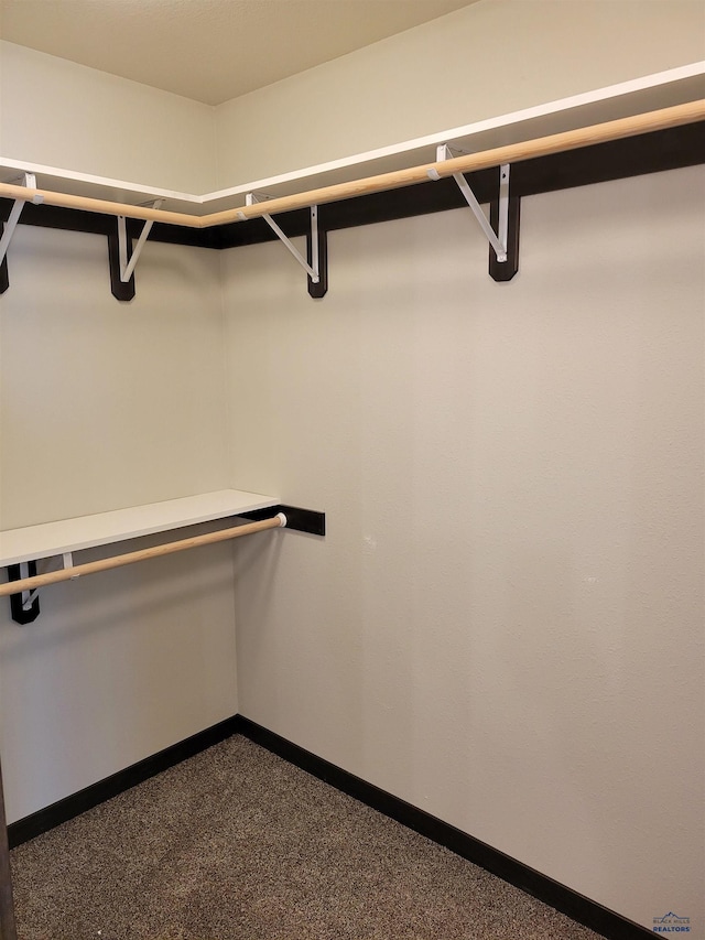 1154 Cobalt Dr, Rapid City, SD 57701 - walk in closet featuring dark colored carpet