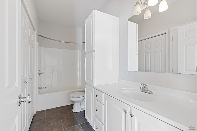 full bath with toilet, tile patterned flooring, vanity, shower / washtub combination, and a closet