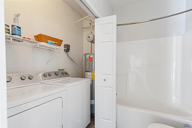 clothes washing area with laundry area, independent washer and dryer, and electric water heater