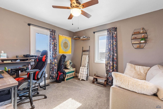 office area featuring ceiling fan, carpet floors, and baseboards