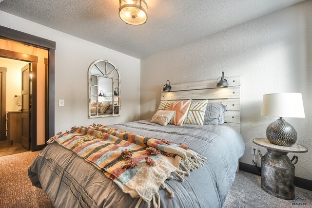 21268 Rubys Way, Lead, SD 57754 - carpeted bedroom with lofted ceiling, a textured ceiling, and a textured wall