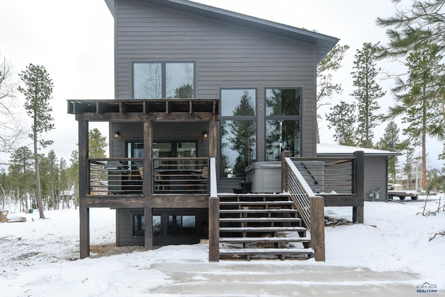 21268 Rubys Way, Lead, SD 57754 - snow covered house featuring stairs and a deck