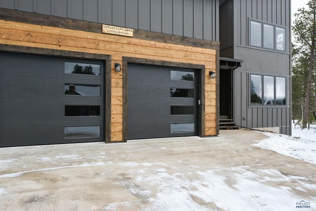21268 Rubys Way, Lead, SD 57754 - entrance to property with driveway, a garage, and board and batten siding