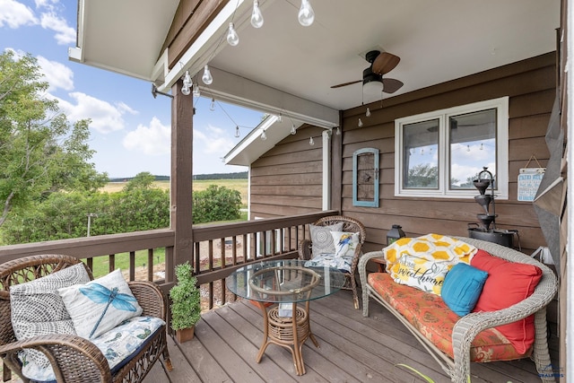 wooden terrace featuring ceiling fan