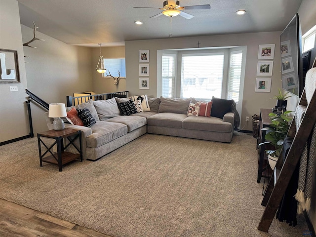 living room featuring ceiling fan, baseboards, wood finished floors, and recessed lighting