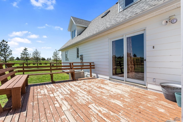 wooden terrace with a yard