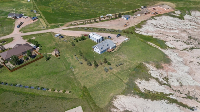 birds eye view of property featuring a rural view