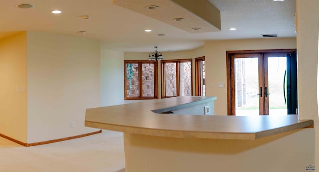 kitchen with recessed lighting, light countertops, visible vents, baseboards, and fridge