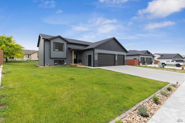 view of front of house with driveway, a front lawn, board and batten siding, and an attached garage