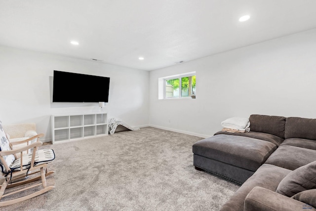 living room featuring baseboards, recessed lighting, and light colored carpet