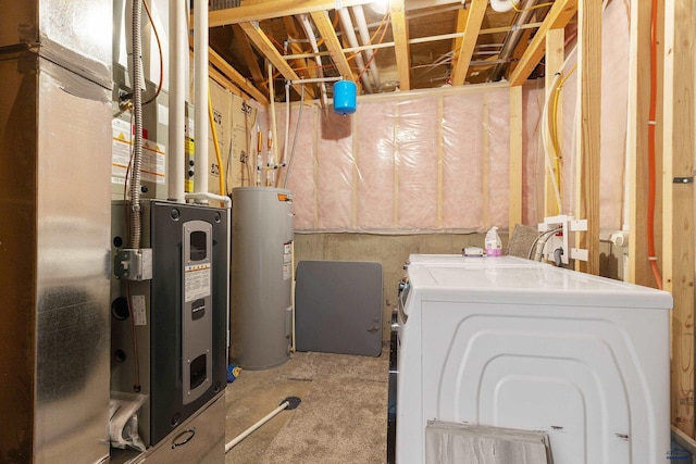 washroom featuring laundry area, independent washer and dryer, and electric water heater