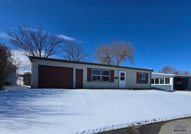 ranch-style home featuring an attached garage