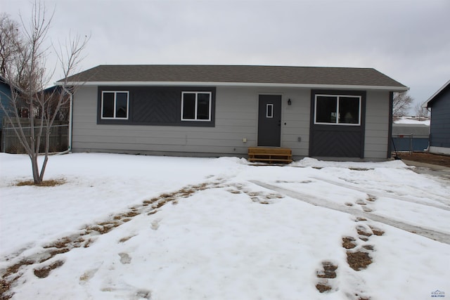 single story home featuring fence