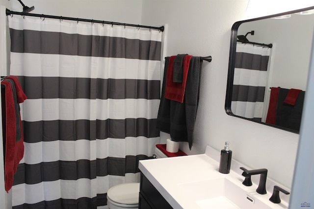 full bathroom with toilet, a shower with curtain, and vanity