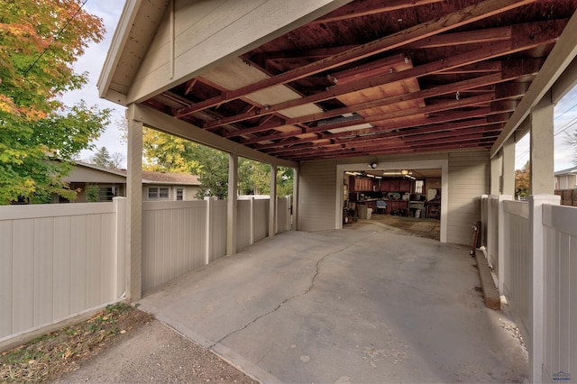 view of parking featuring fence