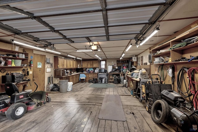 garage featuring a workshop area and a garage door opener