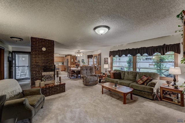 carpeted living room featuring ceiling fan and a textured ceiling