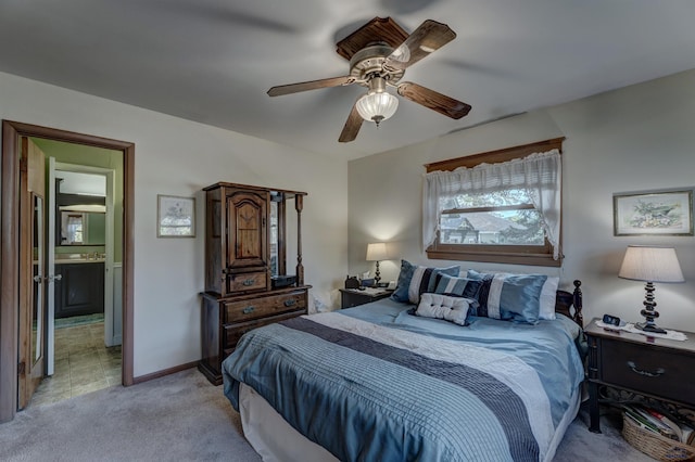 bedroom featuring light carpet, ceiling fan, and baseboards