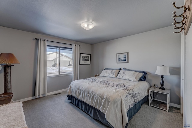 bedroom featuring carpet, visible vents, and baseboards