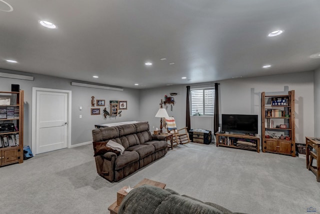 living room with light carpet and recessed lighting