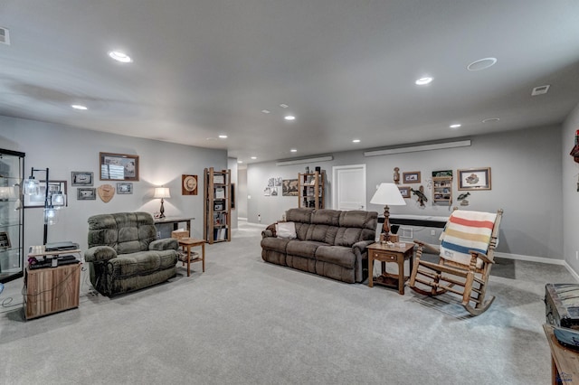 living area featuring light carpet, visible vents, baseboards, and recessed lighting