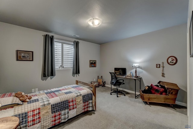 bedroom featuring baseboards, visible vents, and light colored carpet