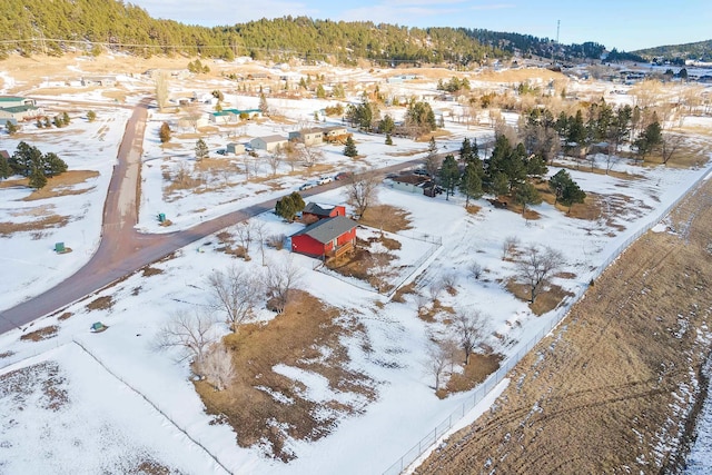 snowy aerial view featuring a residential view