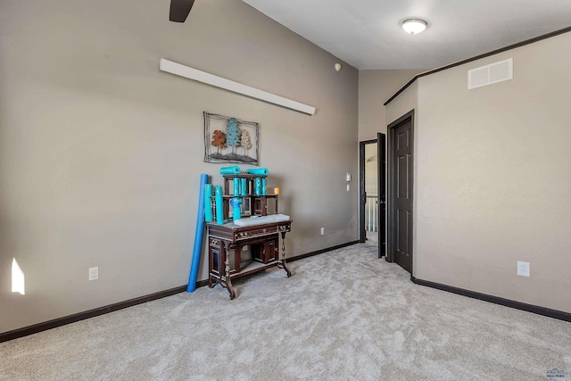 unfurnished room featuring a ceiling fan, light colored carpet, visible vents, and baseboards