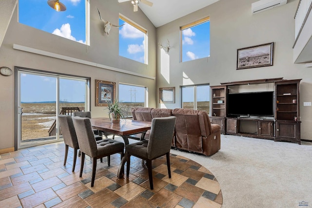 carpeted dining room with a wall unit AC, a ceiling fan, baseboards, and a wealth of natural light