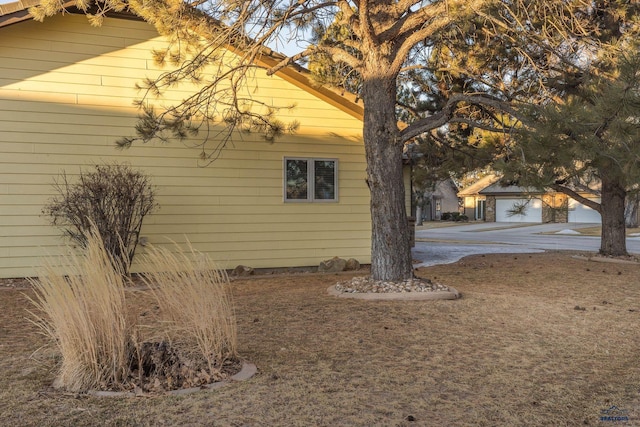 view of side of home with an outbuilding