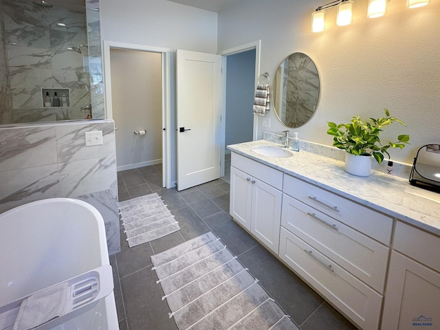 20216 Ponderosa Dr, Whitewood, SD 57793 - bathroom with walk in shower, vanity, a soaking tub, and tile patterned flooring