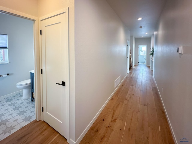 20216 Ponderosa Dr, Whitewood, SD 57793 - hallway featuring light wood-style floors, baseboards, and recessed lighting