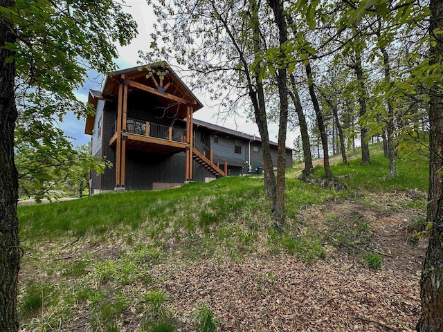 20216 Ponderosa Dr, Whitewood, SD 57793 - back of property featuring stairs and a deck