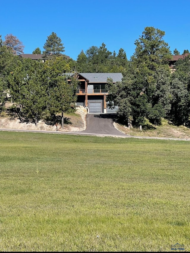 20216 Ponderosa Dr, Whitewood, SD 57793 - view of front of home featuring a front lawn and driveway