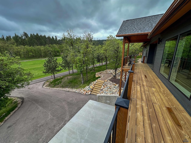 20216 Ponderosa Dr, Whitewood, SD 57793 - wooden terrace featuring a wooded view