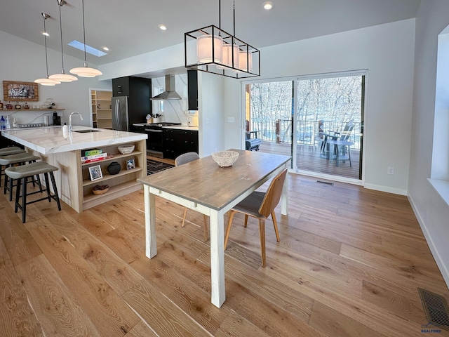 20216 Ponderosa Dr, Whitewood, SD 57793 - dining area with light wood-type flooring, baseboards, and recessed lighting