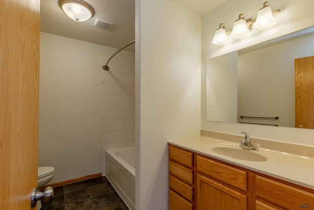 bathroom with baseboards, visible vents, toilet, vanity, and shower / bathtub combination