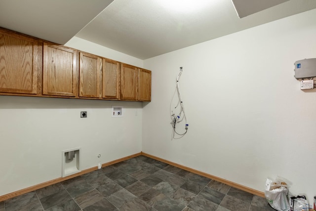 washroom featuring hookup for a washing machine, cabinet space, hookup for an electric dryer, gas dryer hookup, and baseboards