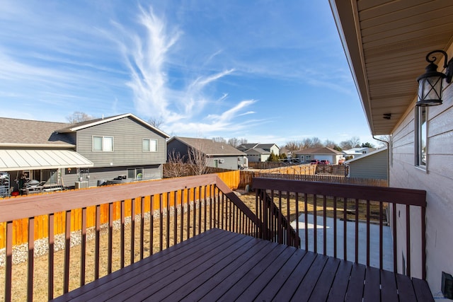 wooden deck featuring a residential view and fence private yard