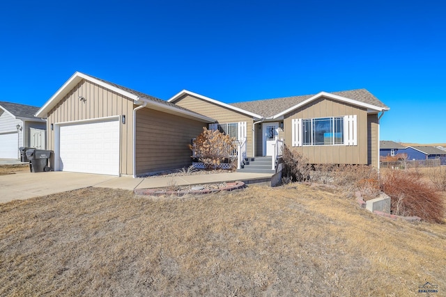 single story home featuring board and batten siding, driveway, a shingled roof, and an attached garage