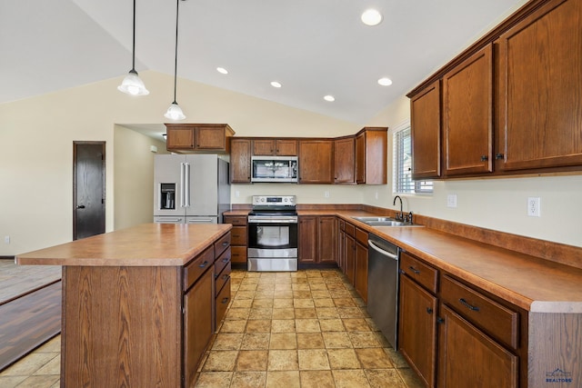 kitchen featuring a kitchen island, appliances with stainless steel finishes, a sink, and recessed lighting