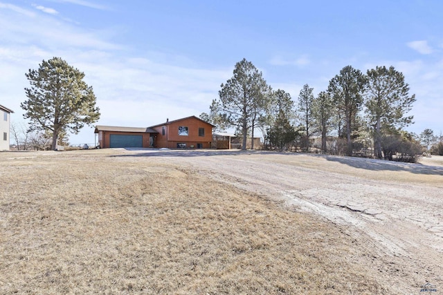 single story home featuring an attached garage