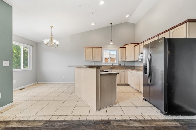 kitchen with a notable chandelier, hanging light fixtures, stainless steel fridge with ice dispenser, and light tile patterned floors