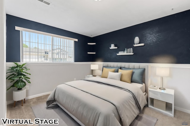 bedroom with baseboards, visible vents, and carpet flooring