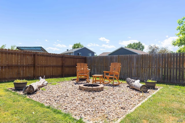 view of yard with an outdoor fire pit and a fenced backyard