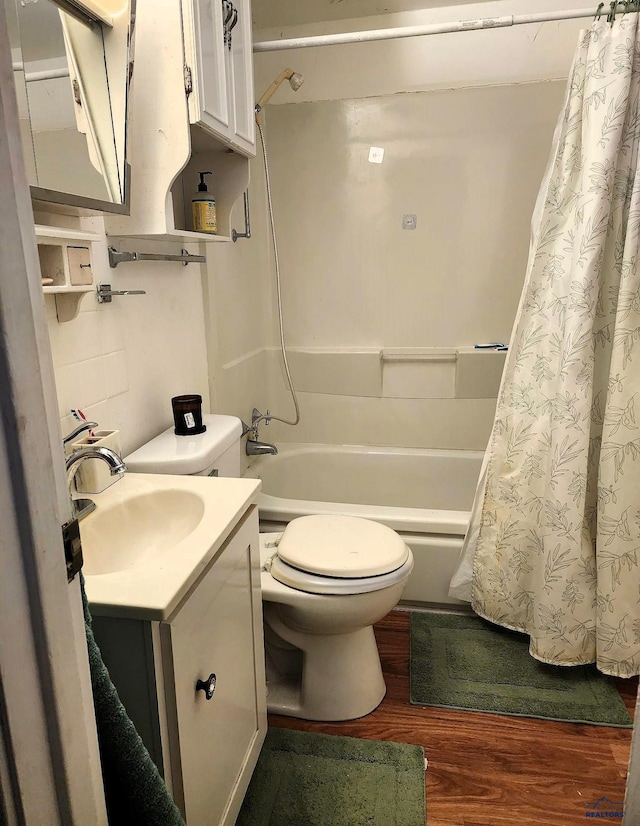 full bath featuring vanity, shower / bathtub combination with curtain, toilet, and wood finished floors