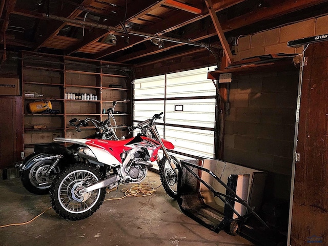 garage with concrete block wall